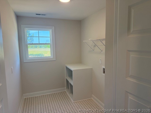 159 Rabbit Run Drive Smithfield, NC 27577 - Photo 15 of 21 a bathroom with a sink a window and shower