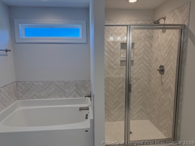 159 Rabbit Run Drive Smithfield, NC 27577 - Photo 19 of 21 a bathroom with a bathtub and a shower