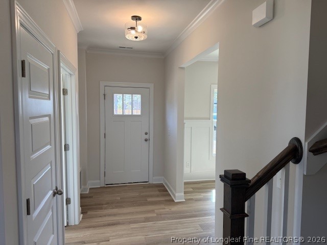 159 Rabbit Run Drive Smithfield, NC 27577 - Photo 2 of 21 a view of a hallway view with wooden floor and staircase