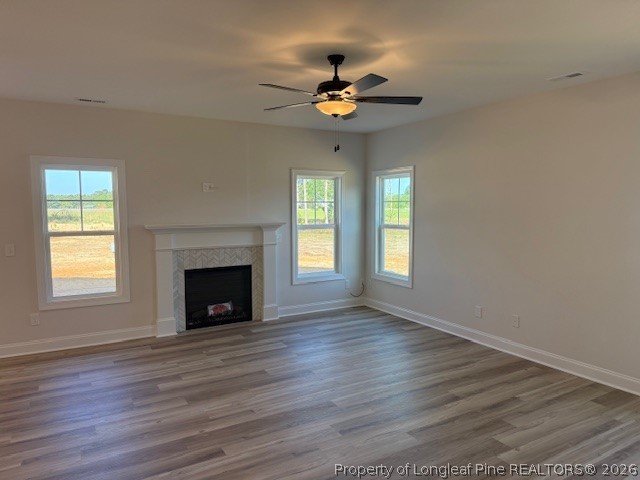 159 Rabbit Run Drive Smithfield, NC 27577 - Photo 5 of 21 a view of an empty room with wooden floor fireplace and a window