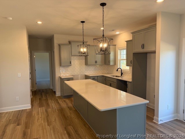 159 Rabbit Run Drive Smithfield, NC 27577 - Photo 6 of 21 a large kitchen with stainless steel appliances a large counter top a sink a refrigerator and a wooden floor