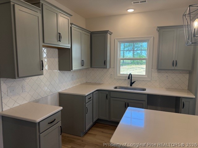 159 Rabbit Run Drive Smithfield, NC 27577 - Photo 7 of 21 a kitchen with stainless steel appliances kitchen island granite countertop a sink dishwasher a stove and a refrigerator with wooden cabinets