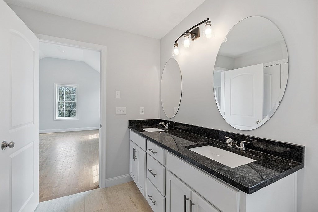 7 Laurel Road Dracut, MA 01826 - Photo 12 of 15 a bathroom with a granite countertop sink and a mirror