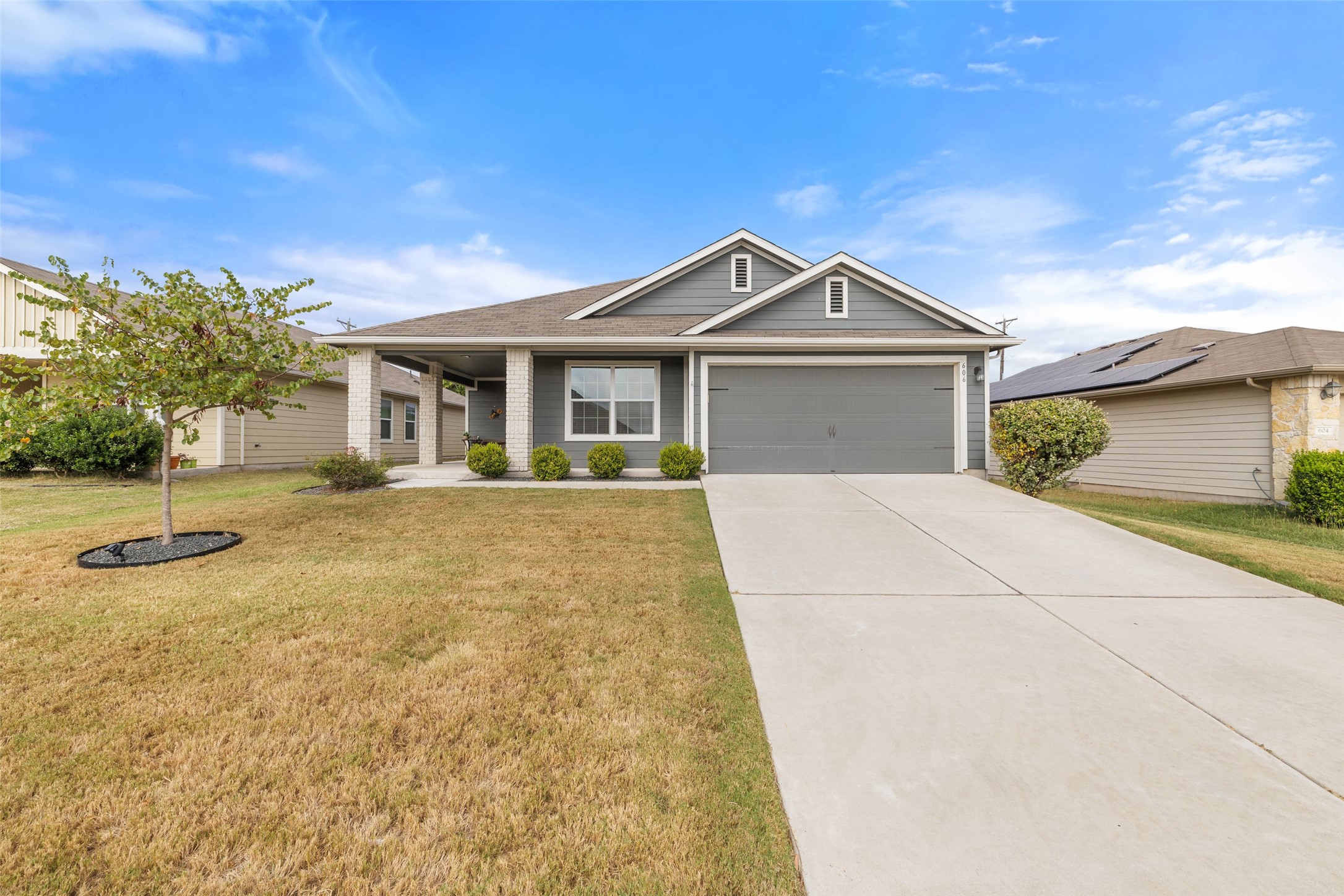 a front view of a house with a yard