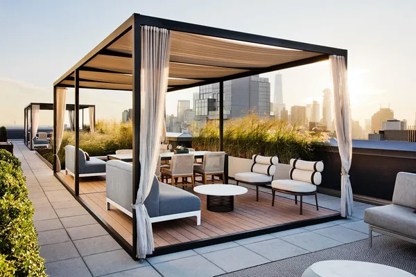 a living room with patio furniture and a floor to ceiling window