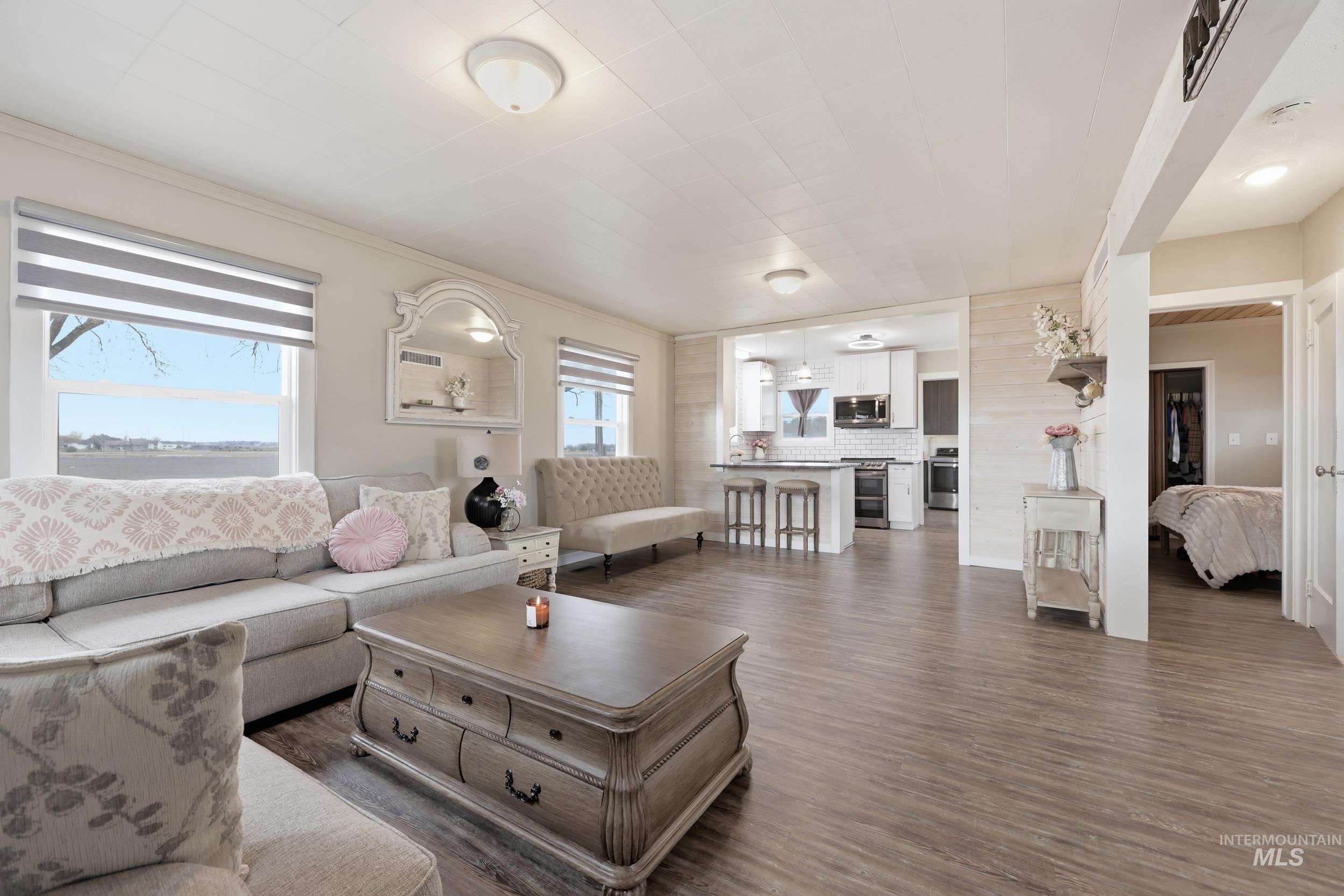 9762 Deer Flat Road Nampa, ID 83686 - Photo 2 of 24 Living room with dark wood-style floors