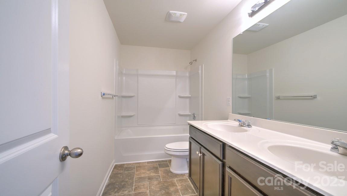 1374 Mifflin Lane Dallas, NC 28034 - Photo 13 of 20 a bathroom with a granite countertop sink a toilet and shower