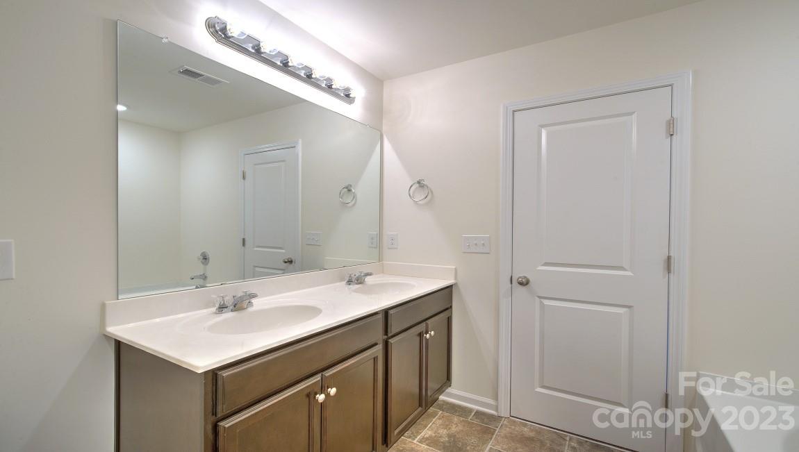 1374 Mifflin Lane Dallas, NC 28034 - Photo 18 of 20 a bathroom with a sink and a mirror