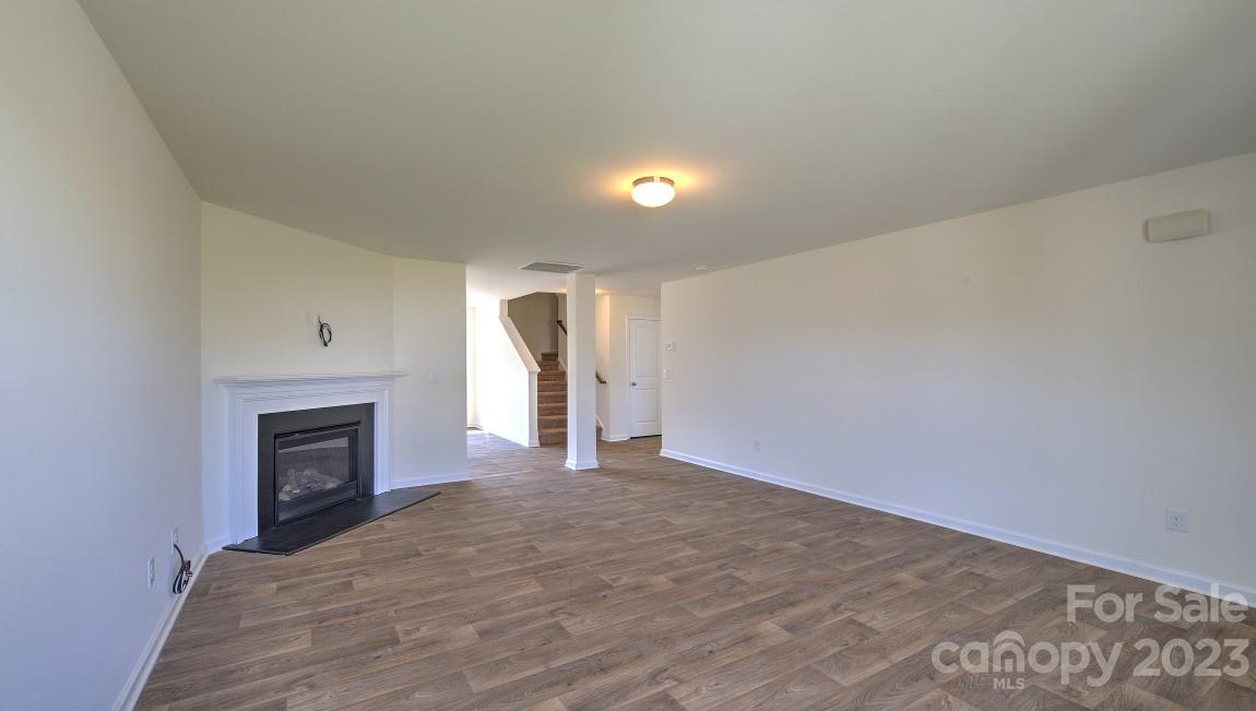 1374 Mifflin Lane Dallas, NC 28034 - Photo 4 of 20 a view of empty room with a fireplace and window