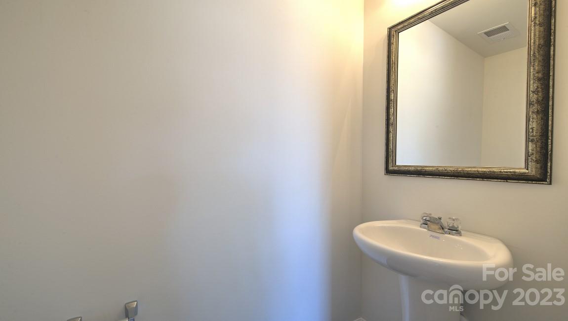 1374 Mifflin Lane Dallas, NC 28034 - Photo 9 of 20 a bathroom with a sink and a mirror
