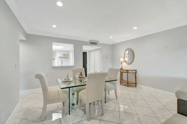 a view of a dining room and chairs in a room