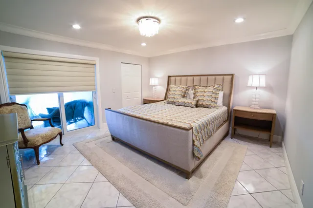 a living room with a bed and furniture