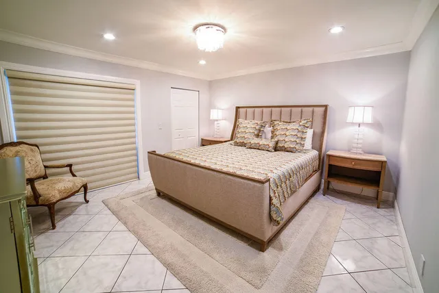 a bedroom with a bed and furniture