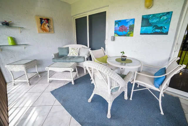 a view of a livingroom with furniture and a rug