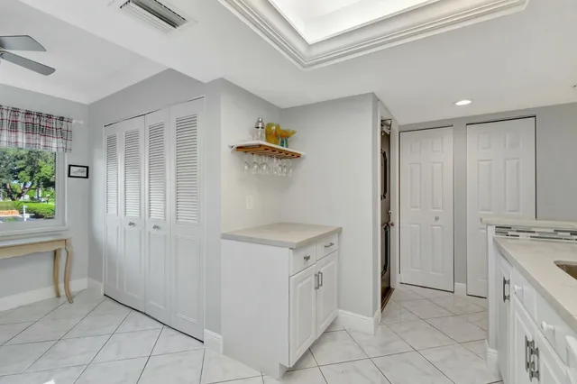 a utility room with cabinets washer and dryer