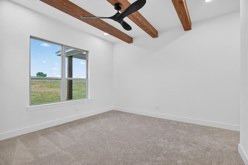 225 Kilkenny Road Poolville, TX 76487 - Photo 17 of 36 Carpeted room with exposed wood ceiling beams and a contemporary ceiling fan