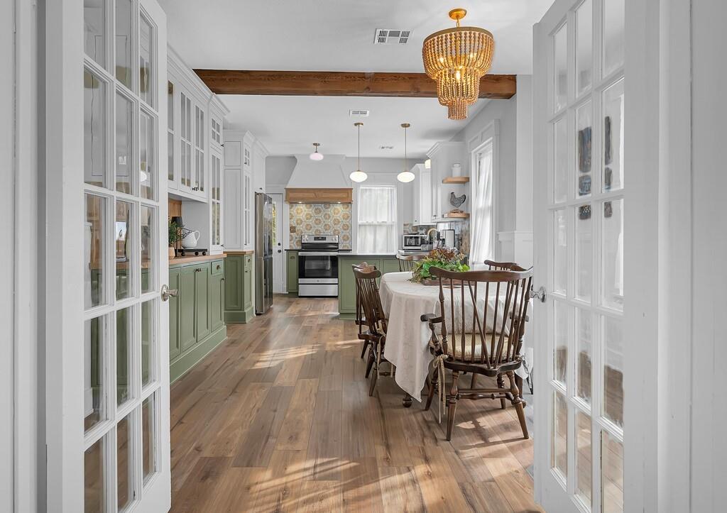 2612 Fort Avenue Waco, TX 76707 - Photo 11 of 40 a view of a dining room with furniture and a chandelier