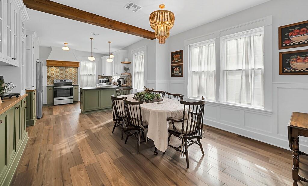2612 Fort Avenue Waco, TX 76707 - Photo 13 of 40 a view of a dining room with furniture window and wooden floor