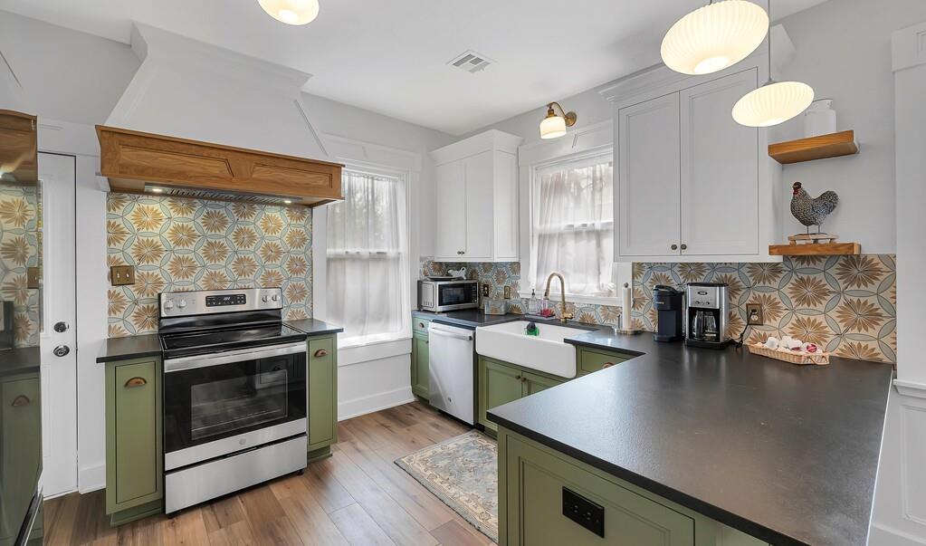 2612 Fort Avenue Waco, TX 76707 - Photo 17 of 40 a kitchen that has a lot of cabinets a sink and appliances in it
