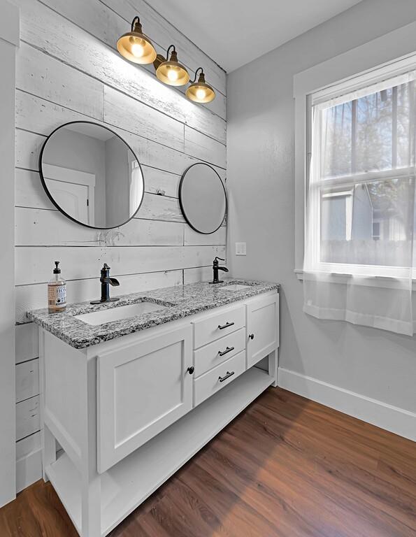 2612 Fort Avenue Waco, TX 76707 - Photo 32 of 40 a bathroom with a granite countertop double vanity sink and a mirror