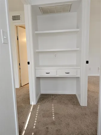 a view of room and cabinets