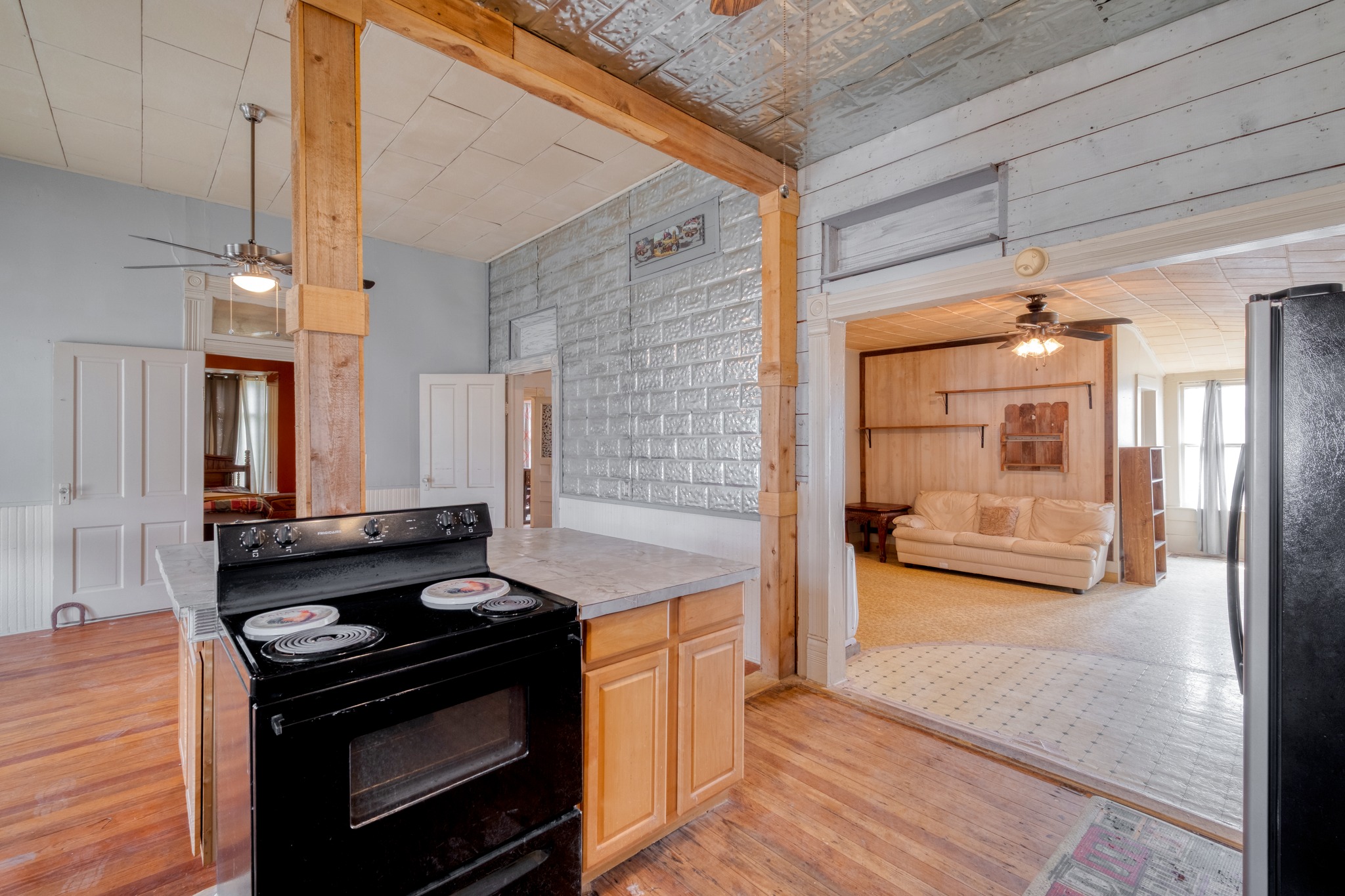300 Rio Grande Street Granger, TX 76530 - Photo 14 of 25 a kitchen with a stove and a wooden floors