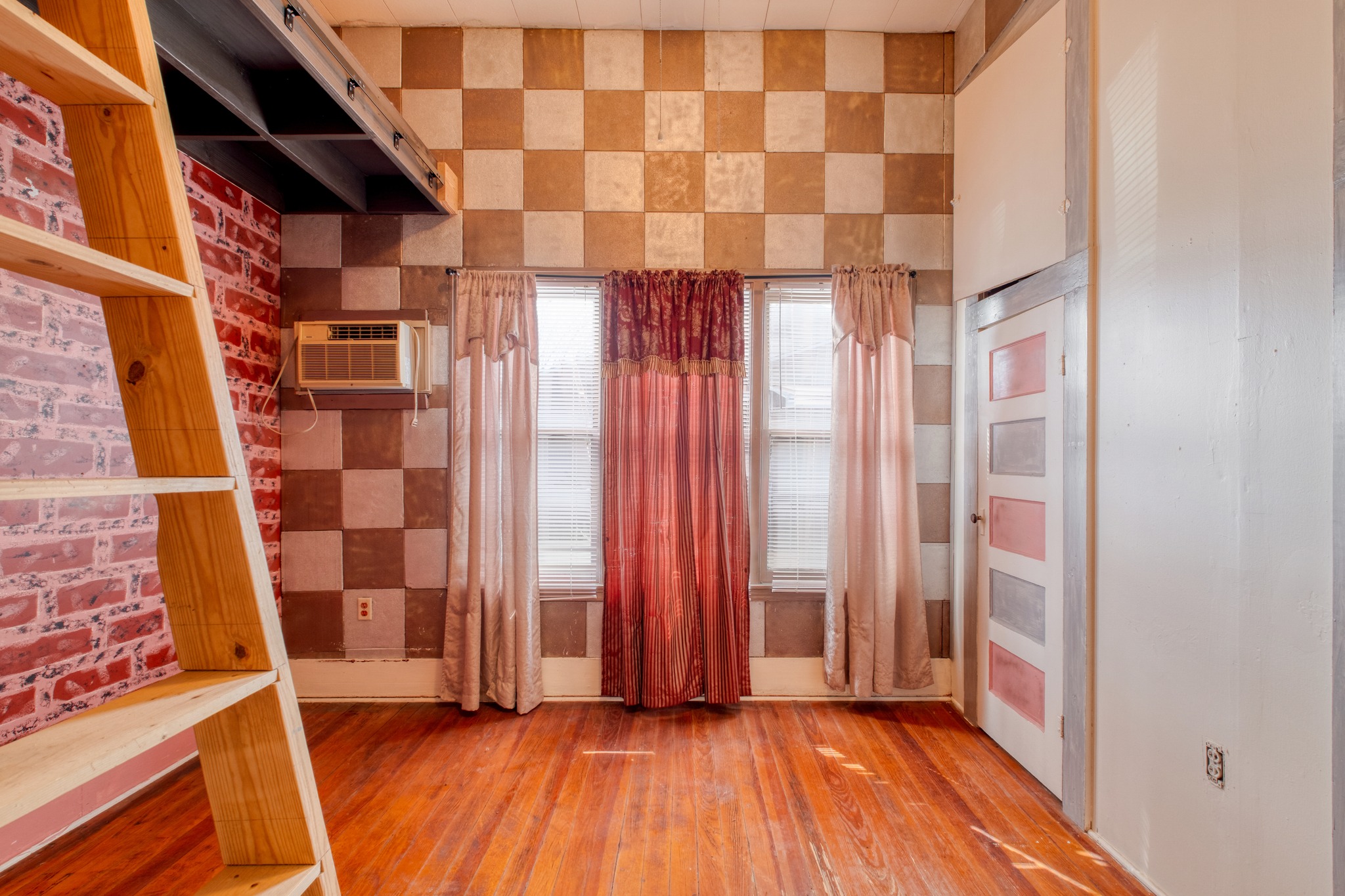 300 Rio Grande Street Granger, TX 76530 - Photo 17 of 25 a view of a room with wooden floor and windows