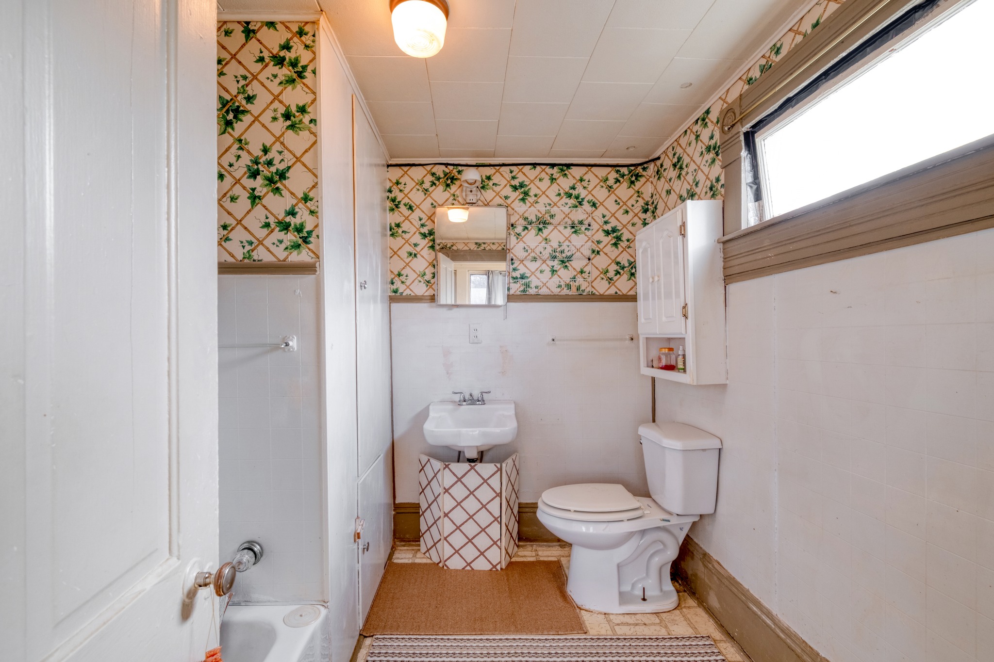 300 Rio Grande Street Granger, TX 76530 - Photo 18 of 25 a bathroom with a toilet and a shower curtain