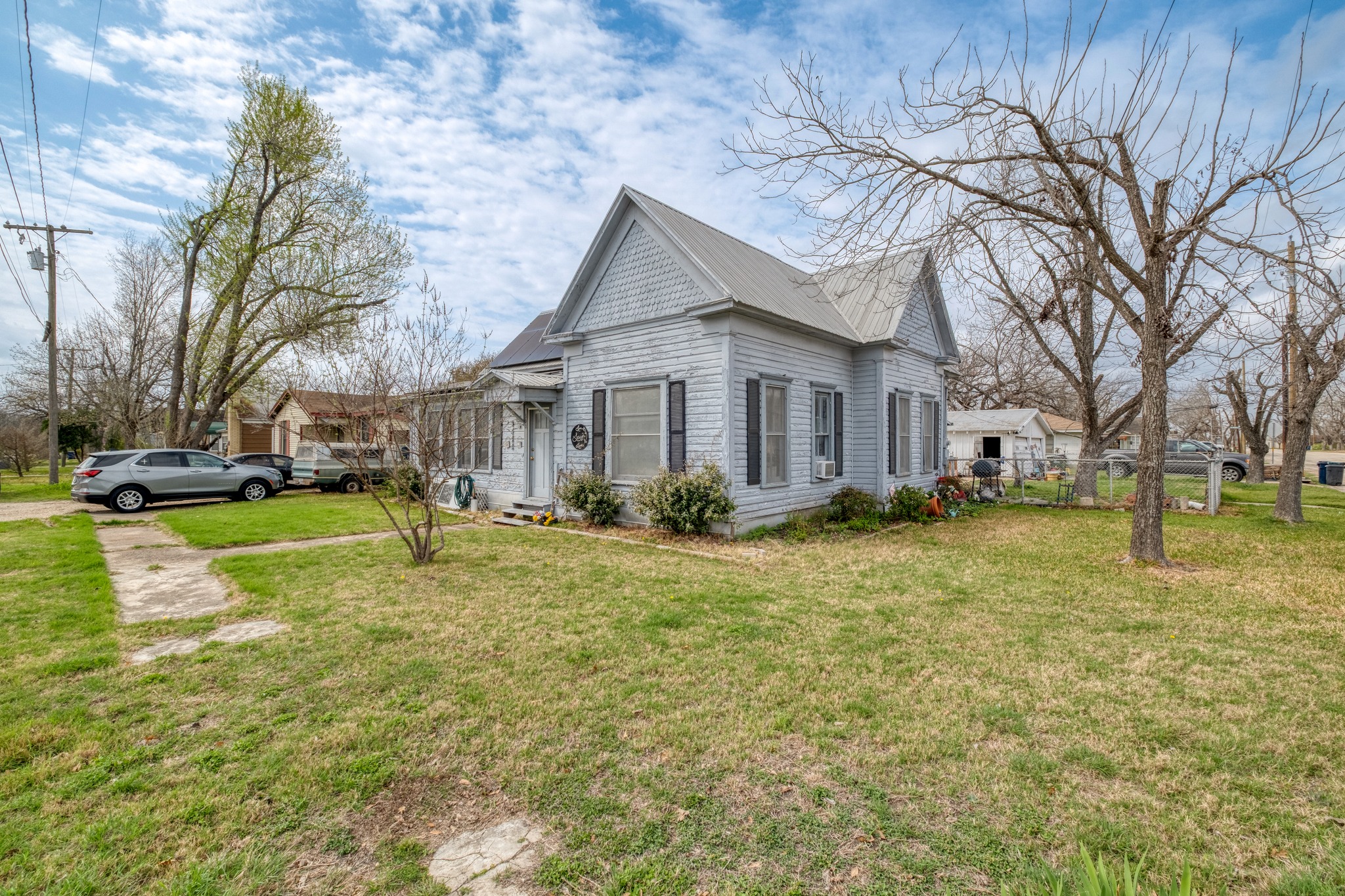 300 Rio Grande Street Granger, TX 76530 - Photo 3 of 25 a view of a yard with a house in the background