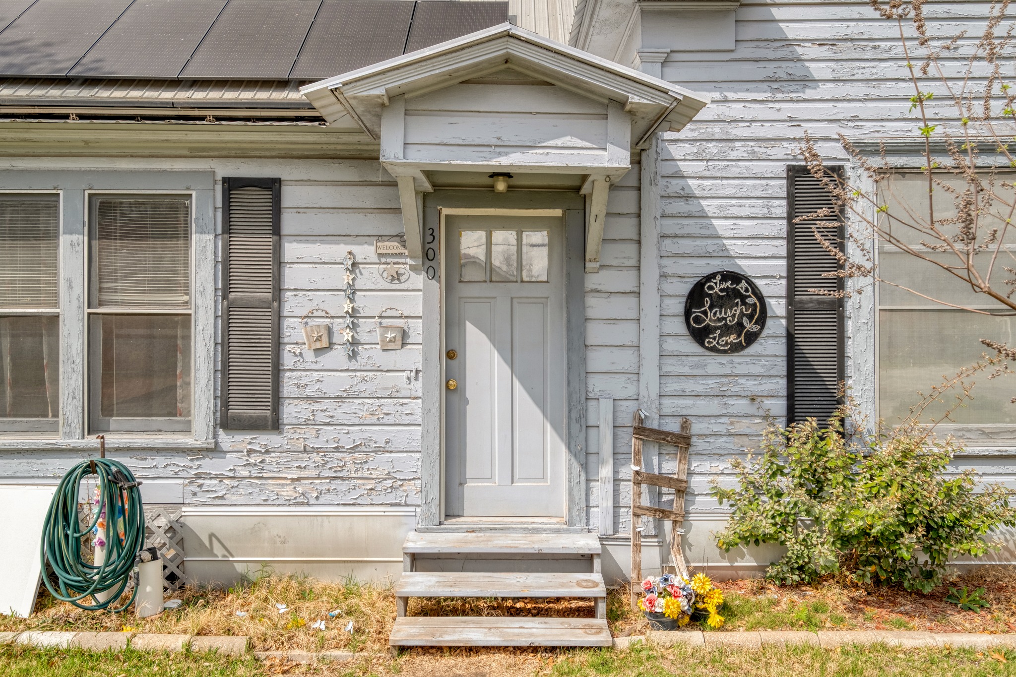 300 Rio Grande Street Granger, TX 76530 - Photo 4 of 25 a front view of a house with a garden