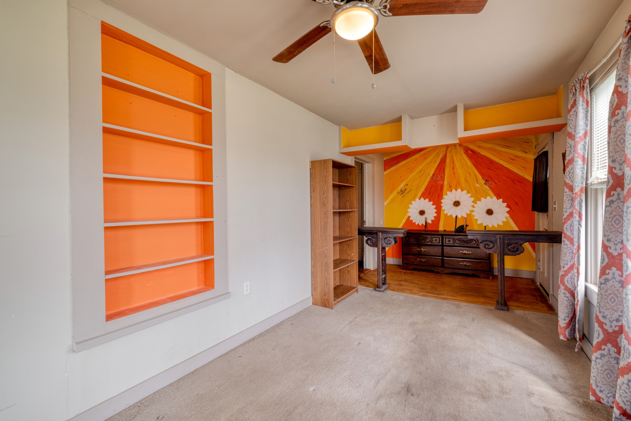 300 Rio Grande Street Granger, TX 76530 - Photo 6 of 25 an empty room with fan wooden floor and window