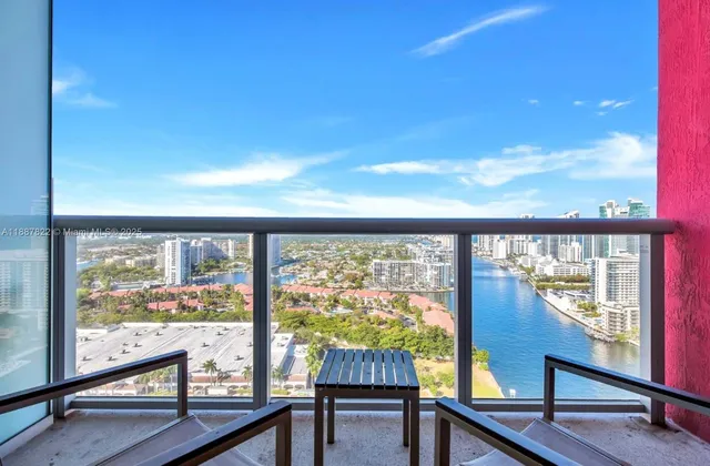 a kitchen with stainless steel appliances granite countertop a refrigerator a stove a sink and a microwave