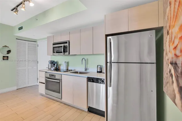 a kitchen with a table and chairs in it