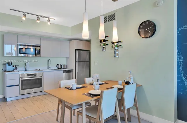 a bedroom with furniture and a large window