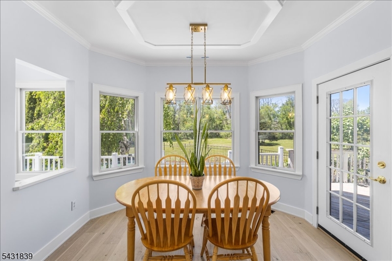 15 Spring Hunter Court Andover, NJ 07821 - Photo 25 of 49 a view of a dining room with furniture window and outside view