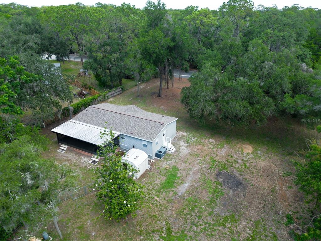 1819 Sinclair Hills Road Lutz, FL 33549 - Photo 4 of 60 an aerial view of a house with a yard