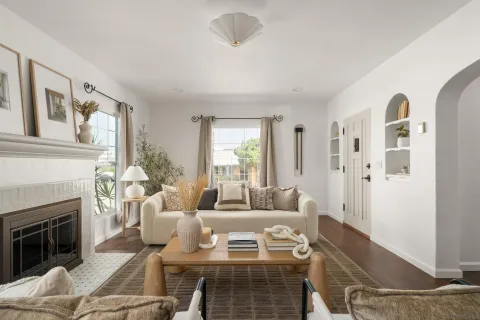 a living room with furniture and a fireplace