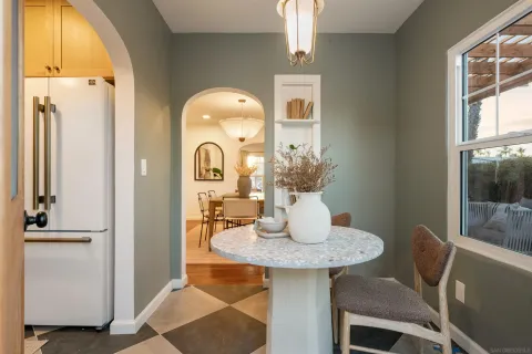 a kitchen with a table and chair