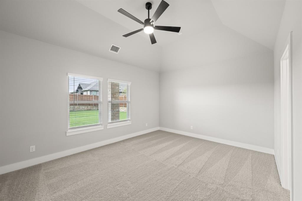 620 Red Maple Road Waxahachie, TX 75165 - Photo 11 of 40 an empty room with a window and a fan