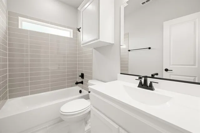 a spacious bathroom with a shower a sink and a mirror