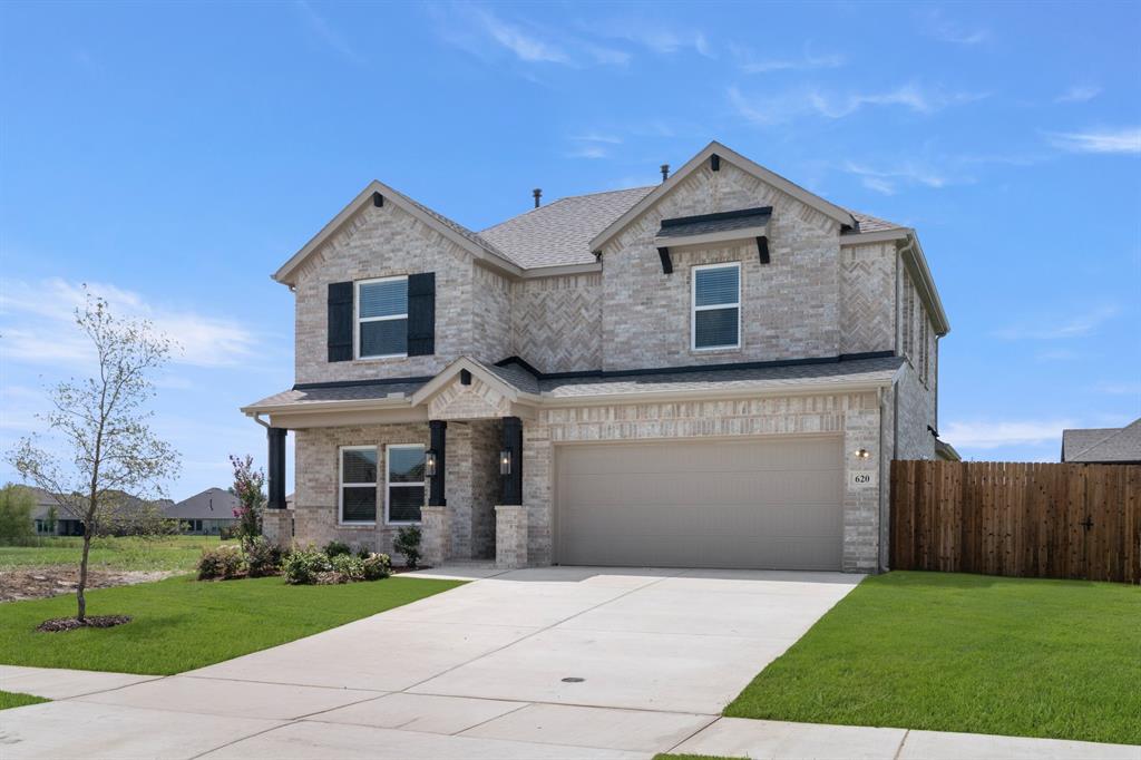620 Red Maple Road Waxahachie, TX 75165 - Photo 2 of 40 a front view of a house with a yard
