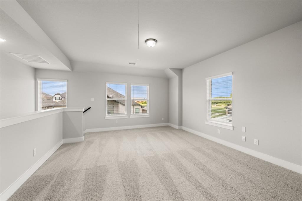 620 Red Maple Road Waxahachie, TX 75165 - Photo 23 of 40 a view of an empty room and a window