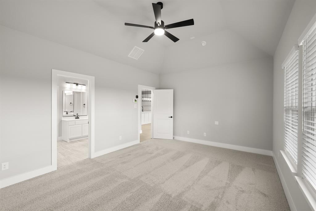 620 Red Maple Road Waxahachie, TX 75165 - Photo 28 of 40 an empty room with fan and windows