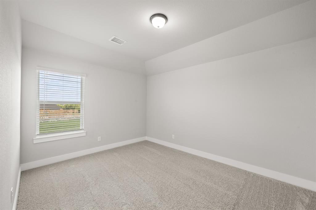620 Red Maple Road Waxahachie, TX 75165 - Photo 34 of 40 an empty room with a window