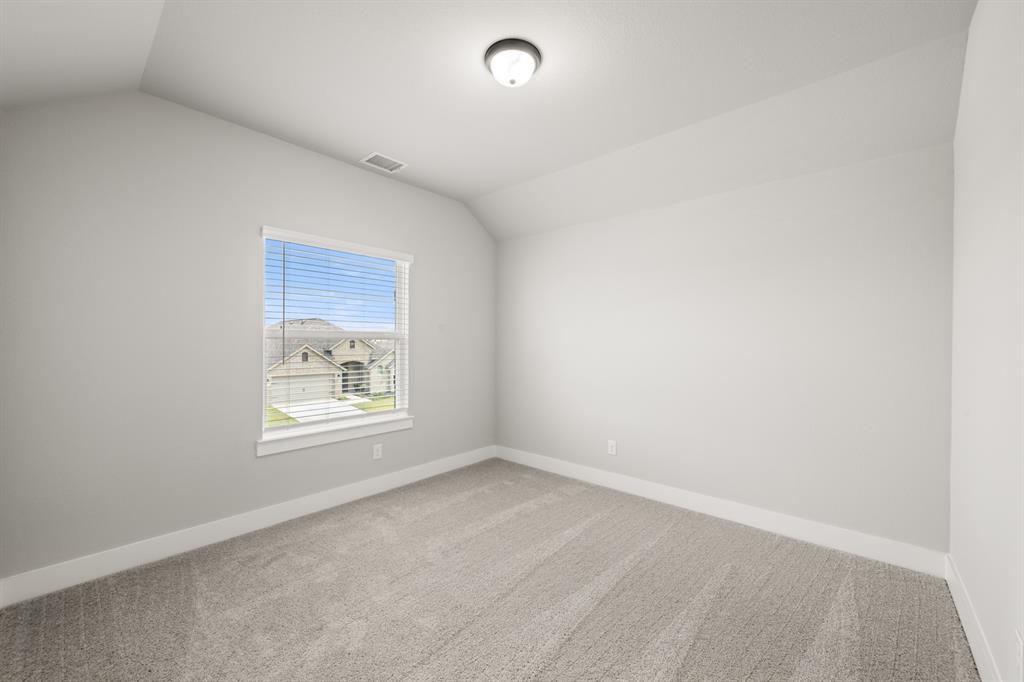 620 Red Maple Road Waxahachie, TX 75165 - Photo 35 of 40 an empty room with a window