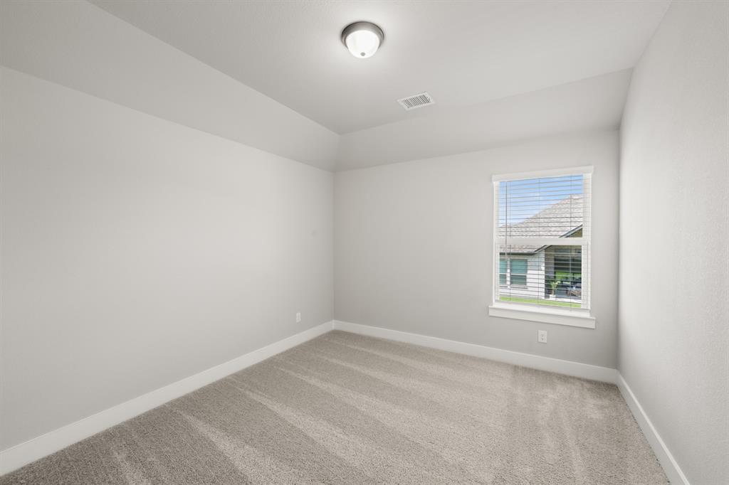 620 Red Maple Road Waxahachie, TX 75165 - Photo 37 of 40 an empty room with a window