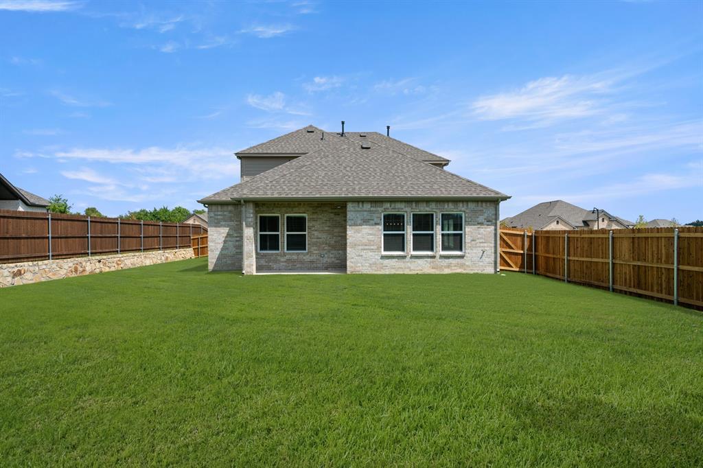 620 Red Maple Road Waxahachie, TX 75165 - Photo 39 of 40 a view of a house with backyard
