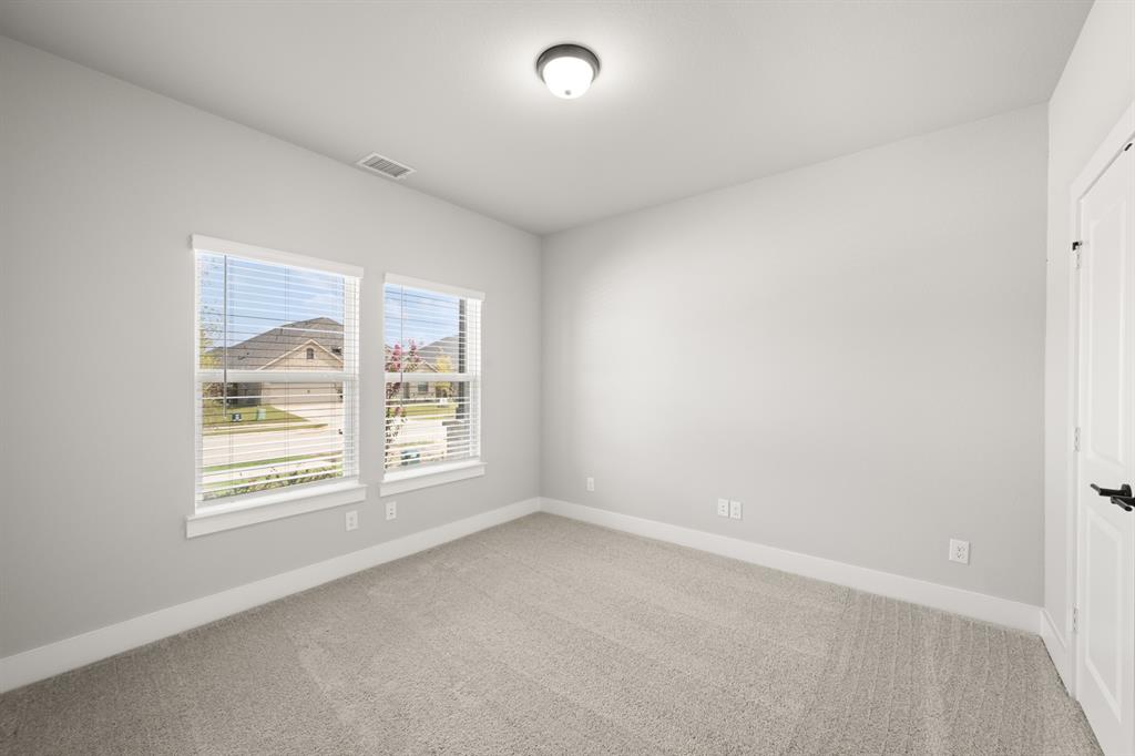 620 Red Maple Road Waxahachie, TX 75165 - Photo 10 of 40 an empty room with a window