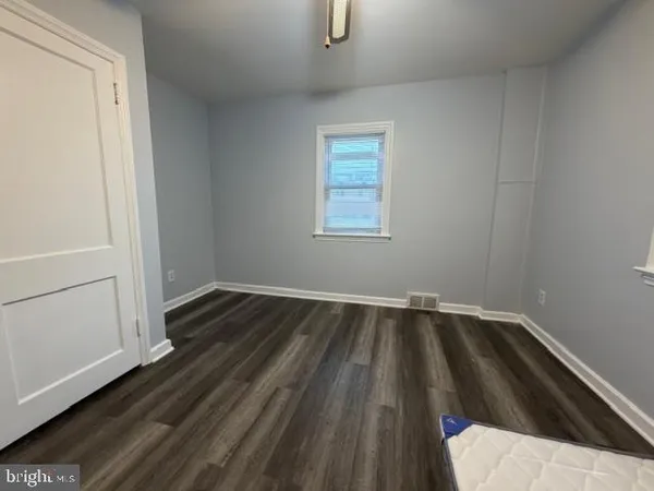 a view of wooden floor in an empty room