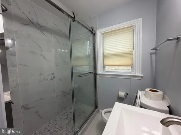 a bathroom with a bathtub and shower